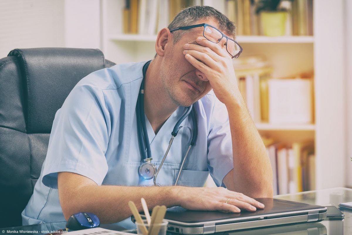 Overworked doctor in office | Image Credit: ©  Monika Wisniewska - stock.adobe.com