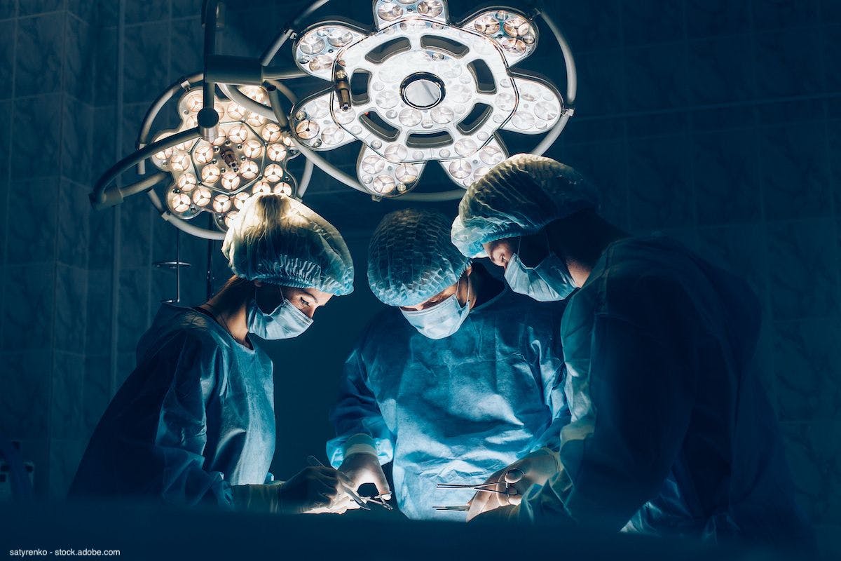 3-person team performing surgery