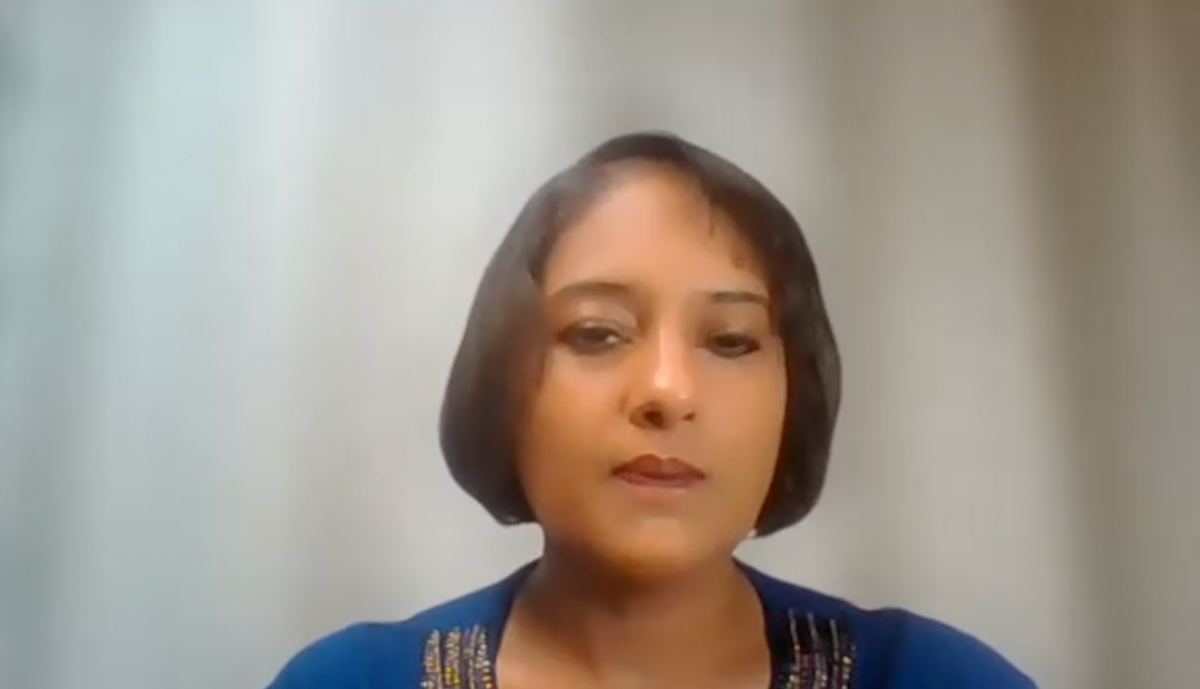Smita De, MD, PhD, answers a question during a Zoom video interview