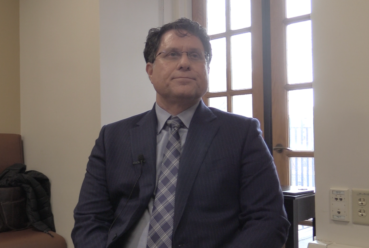 Michael Karellas, MD, answers a question during a video interview