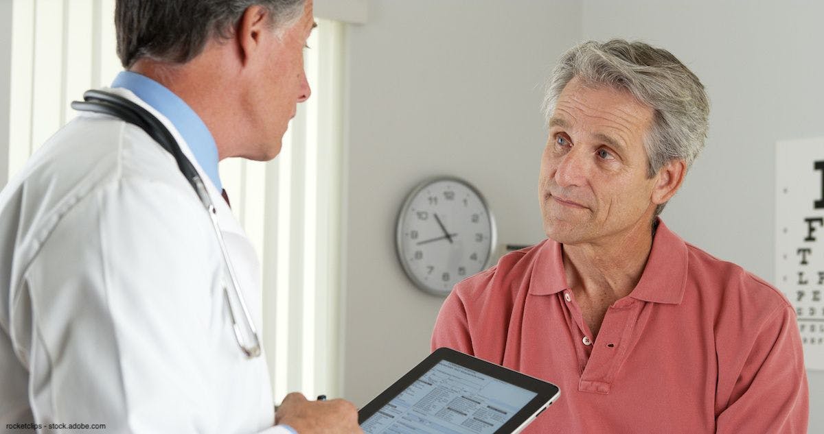 Doctor discusses treatment information with patient