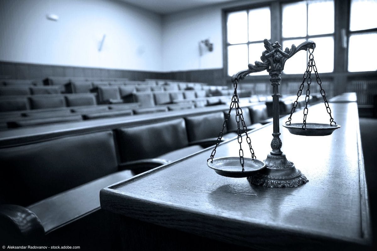 Scales of justice in courtroom | Image Credit: ©  Aleksandar Radovanov - stock.adobe.com