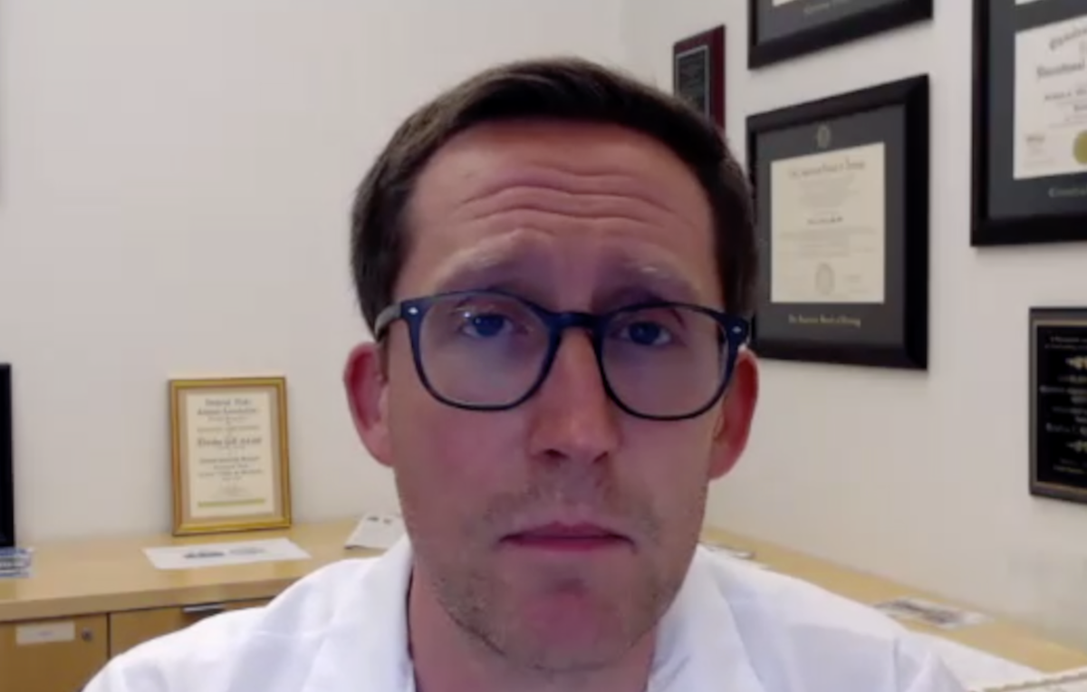 Bradley Gill, MD, MS, answers a question during a Zoom video interview