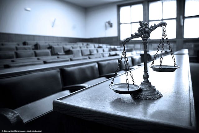 Scales of justice in courtroom | Image Credit: © Aleksandar Radovanov - stock.adobe.com  